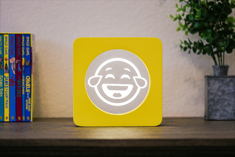 Laughing EmojiGLO - Emoji based 2D LED Light in iconic Emoji Yellow/Red wood frame with interchangeable emojis