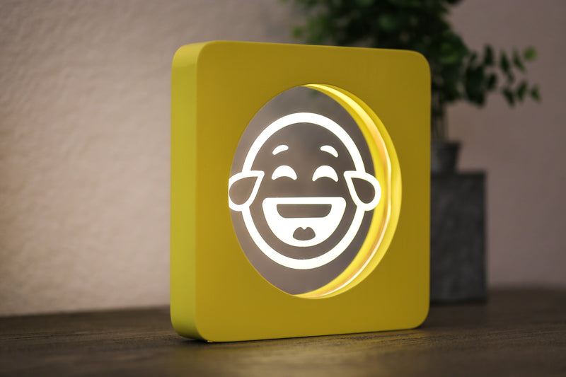 Laughing EmojiGLO - Emoji based 2D LED Light in iconic Emoji Yellow/Red wood frame with interchangeable emojis