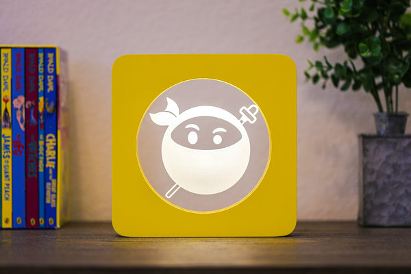 Ninja EmojiGLO - Emoji based 2D LED Light in iconic Emoji Yellow/Red wood frame with interchangeable emojis